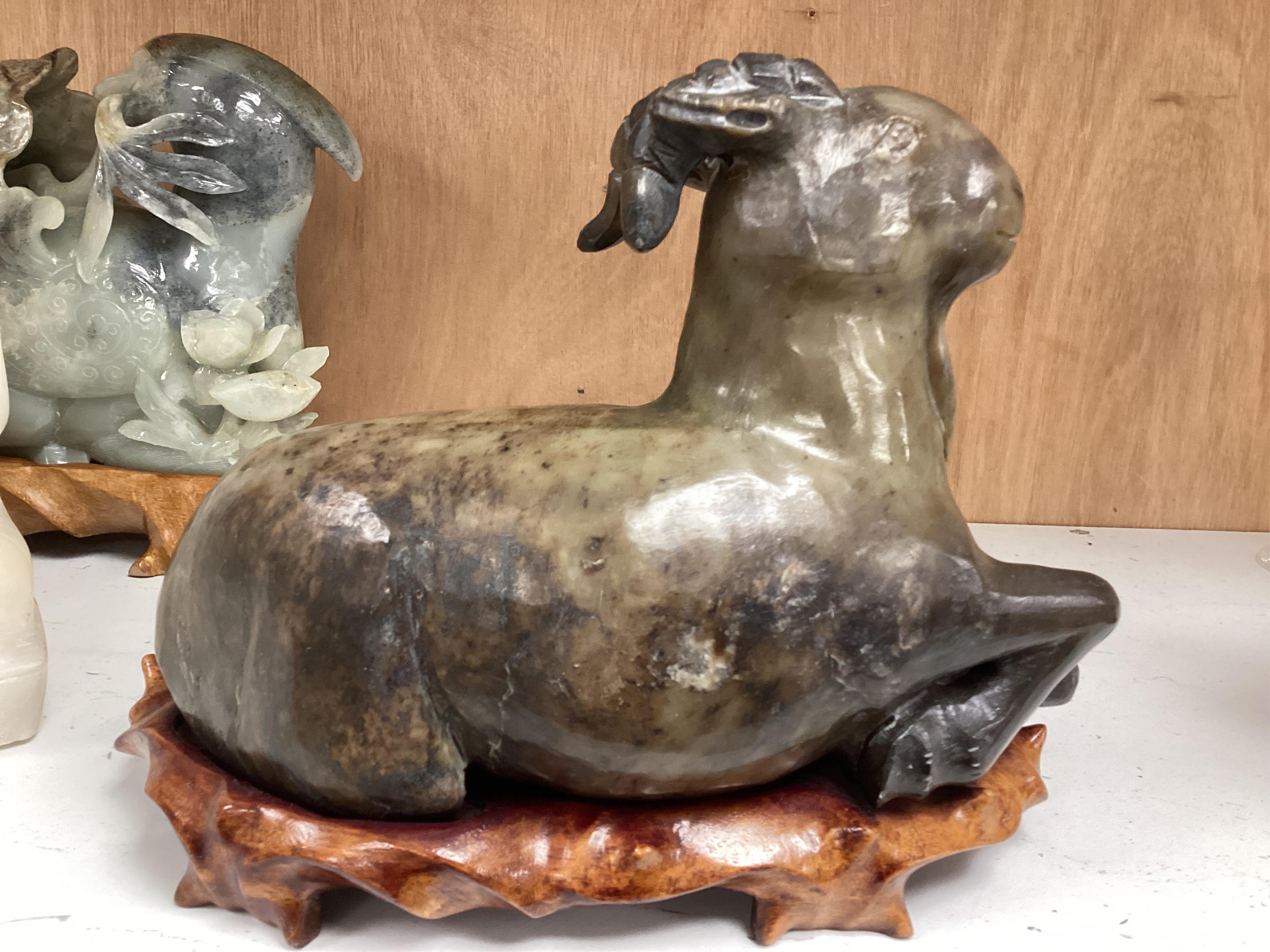 Two modern jade figures, together with a marble Buddha and a carved giltwood figure, largest 24cm wide